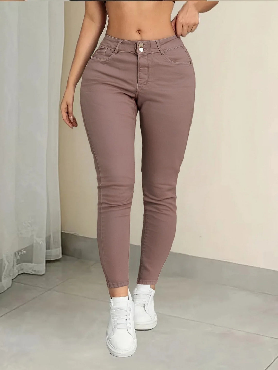 Pink women's Curvy (plus-size) jeans, stretchy skinny denim pants that fit comfortably against the skin and resist deformation