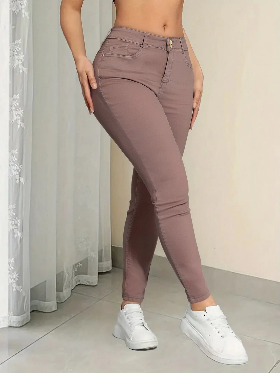 Pink women's Curvy (plus-size) jeans, stretchy skinny denim pants that fit comfortably against the skin and resist deformation